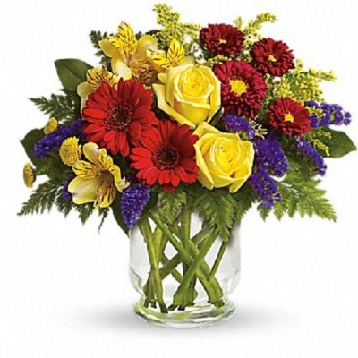 <div class="m-pdp-tabs-description">
<div id="mark-1" class="m-pdp-tabs-marketing-description">You'll want to put this colorful bouquet on your hit parade of gifts to send. Bold primary colors and a perfect mix of flowers make it great for men and women of all ages. In other words, it's a perfect arrangement.</div>
</div>
<p id="arrngDescp">Yellow roses, alstroemeria, and button spray chrysanthemums, red miniature gerberas and matsumoto asters along with purple statice, salal and fern are delivered in a lovely hurricane vase. It's a garden parade to be proud of!</p>