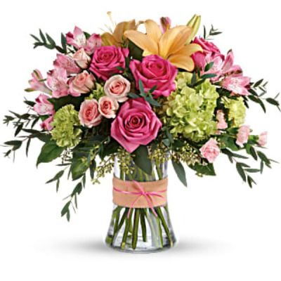 <div id="mark-3" class="m-pdp-tabs-marketing-description">Put a spring in their step with this beautifully blushing bouquet of hot pink roses, soft peach lilies and fresh green hydrangea. Arranged in a graceful vase tied with a charming bow, it's a chic treat for any occasion!</div>
<div id="desc-3">
<ul>
 	<li>This sweet arrangement features green hydrangea, hot pink roses, pink spray roses, peach asiatic lilies, pink alstroemeria, green carnations, pink miniature carnations, seeded eucalyptus, parvifolia eucalyptus, and lemon leaf.</li>
</ul>
</div>