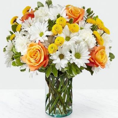 Through a collection of bold hues, gorgeous flowers, and fresh scents, this bouquet blossoms with beauty in any room that its placed. An array of orange roses, variegated pittosporum, and white daisy pompons come together in a cylindrical glass vase to make the perfect gift for a loved one near or far.

STANDARD bouquet is approx. 13H x 13W.
DELUXE bouquet is approx. 14H x 14W.
PREMIUM bouquet is approx. 15H x 15W.