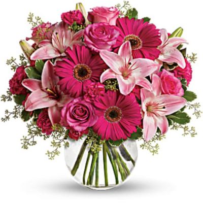 Sometimes all you need is a little pink me up! An ideal pick for anyone whose favorite color is pink, this stylish mix is full of variety and comes presented in a clear glass bubble bowl they'll use again and again.
A wide variety of flowers including pink roses, pink asiatic lilies, hot pink gerberas, pink carnations and hot pink miniature carnations are mixed with fresh variegated pittosporum and seeded eucalyptus.